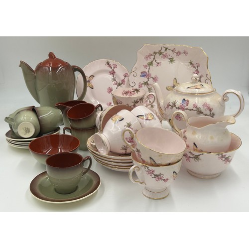 133 - A pink Tuscan bone china tea service with blossom and butterfly pattern (teapot, milk, sugar, 6 x cu... 