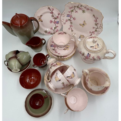 133 - A pink Tuscan bone china tea service with blossom and butterfly pattern (teapot, milk, sugar, 6 x cu... 