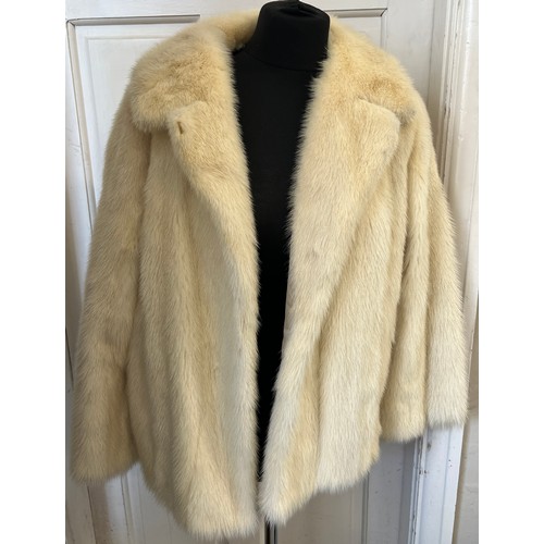 708 - A vintage short pale mink jacket. Approximately 58cm laid flat across the chest.