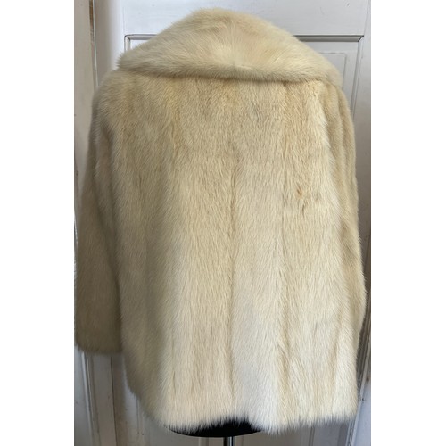 708 - A vintage short pale mink jacket. Approximately 58cm laid flat across the chest.