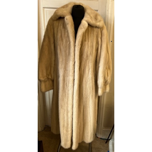 712 - A long pale mink fur coat with label for Konrad Furs Sloane Street London.