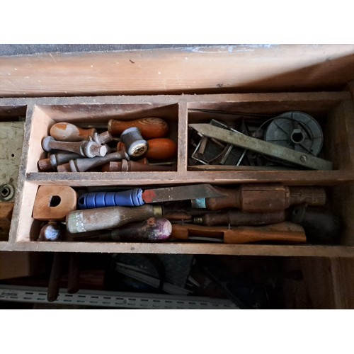 19 - A large vintage pine chest filled with an assortment of tools.