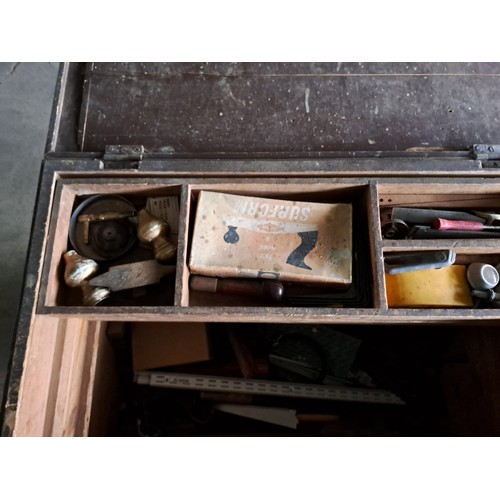 19 - A large vintage pine chest filled with an assortment of tools.