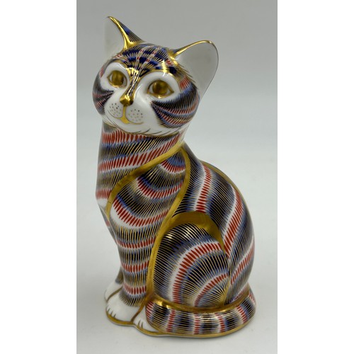 128 - A collection of ceramic cats to include a Royal Crown Derby seated cat with gold stopper (13cm) and ... 