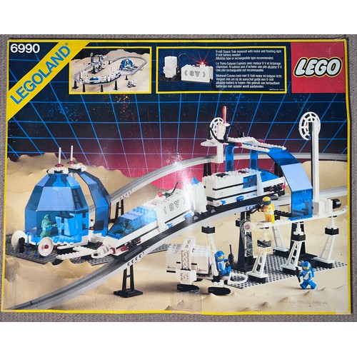 1195 - A boxed Lego 6990 Space Monorail and possible track extensions 6921.