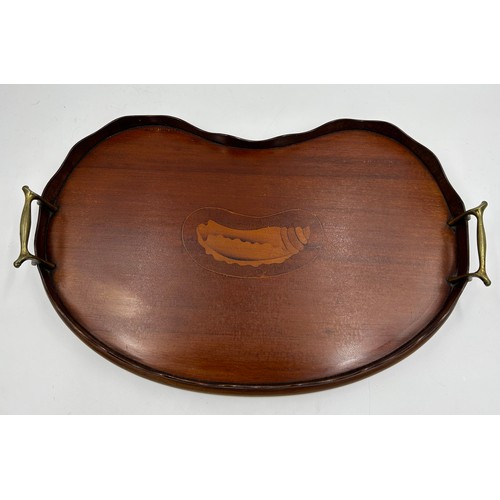 1326 - An Edwardian Mahogany kidney shaped tray with brass handles and shell inlay to centre. 45cm x 28cm.