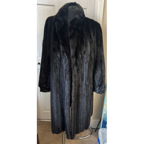 709 - A long length black mink coat.