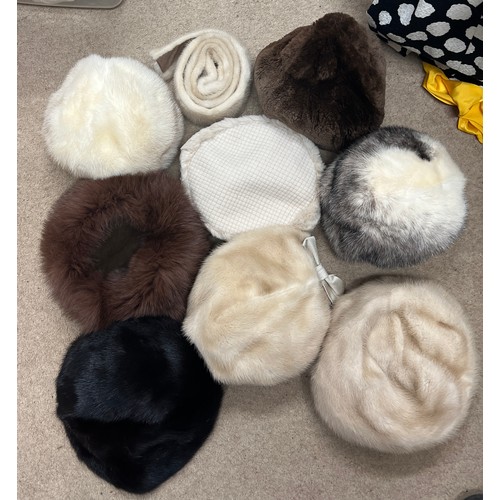 711 - Eight various vintage fur hats and a mink belt.