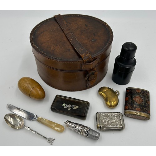 1327 - A miscellany to include : leather collar box, silver plated etui, ebony cased scent bottle, horn snu... 