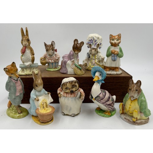 113 - Ten Beswick Beatrix Potter figures comprising: Lady Mouse, Hunca Munca Sweeping, Samuel Whiskers, Mr... 