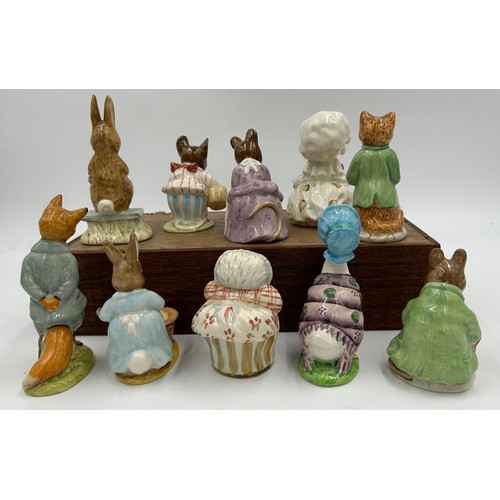 113 - Ten Beswick Beatrix Potter figures comprising: Lady Mouse, Hunca Munca Sweeping, Samuel Whiskers, Mr... 