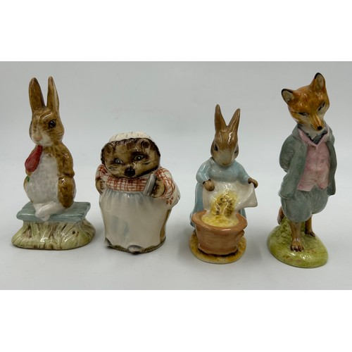 113 - Ten Beswick Beatrix Potter figures comprising: Lady Mouse, Hunca Munca Sweeping, Samuel Whiskers, Mr... 