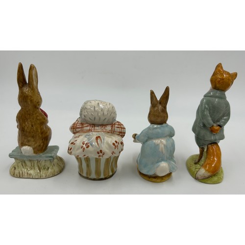 113 - Ten Beswick Beatrix Potter figures comprising: Lady Mouse, Hunca Munca Sweeping, Samuel Whiskers, Mr... 