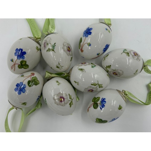 120 - A collection of eight Royal Copenhagen porcelain eggs, 4 x blue hepatica and 4 x pansy. 5.5cm.