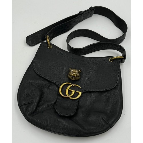 702 - A real black leather jacket by Deja - Vu along with a genuine black leather Gucci Marmont bag. Jacke... 