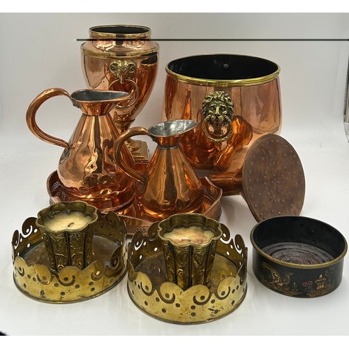 419 - Various copper and brass items to include: a planter with ring and lion handles 21.5cm h, an urn wit... 