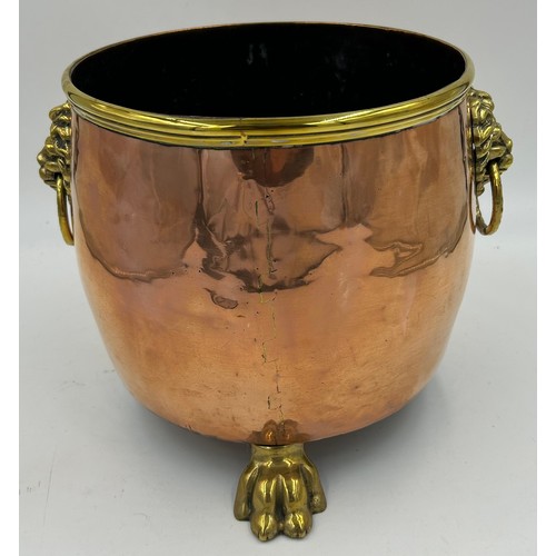 419 - Various copper and brass items to include: a planter with ring and lion handles 21.5cm h, an urn wit... 