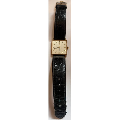 797 - A 9ct gold gentleman's Omega De Ville wristwatch on black leather strap and cream coloured square fa... 