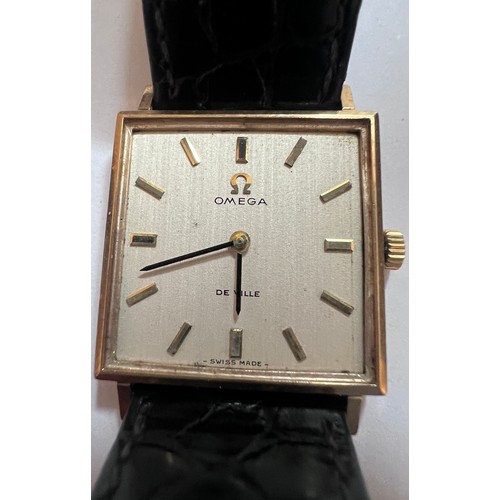 797 - A 9ct gold gentleman's Omega De Ville wristwatch on black leather strap and cream coloured square fa... 