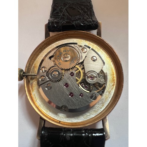 799 - A 9ct gold gentleman's Rotary wristwatch on black leather strap, engraved to back British Rail L.N.F... 