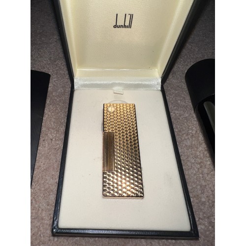 1338 - A gold plated Dunhill lighter together with Dunhill matches, butane gas, bad and leather pouch.