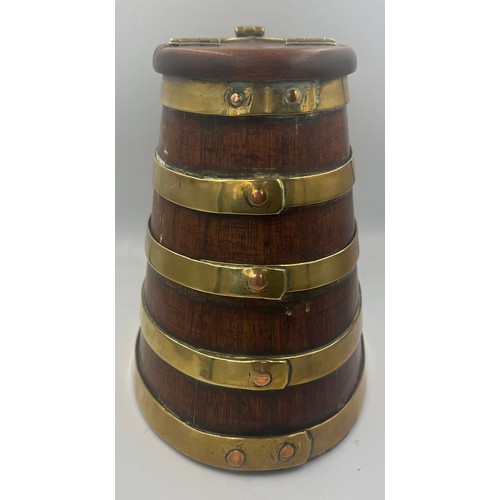 1344 - A coopered wooden barrel with hinged lift up lid and brass fittings. 20cm h.