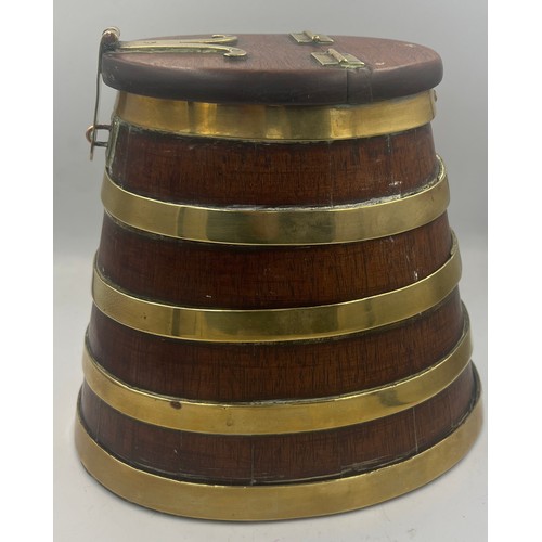 1344 - A coopered wooden barrel with hinged lift up lid and brass fittings. 20cm h.