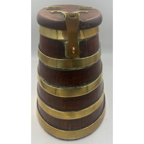 1344 - A coopered wooden barrel with hinged lift up lid and brass fittings. 20cm h.