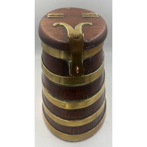 1344 - A coopered wooden barrel with hinged lift up lid and brass fittings. 20cm h.