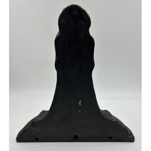 418 - A heavy cast iron doorstop, 34cm h.