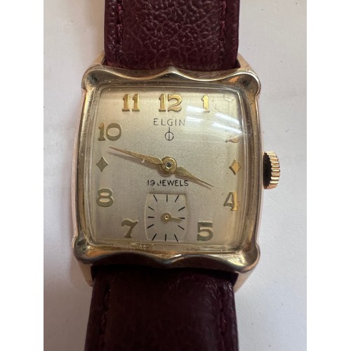 793 - An art deco style 14ct rolled gold bezel Elgin wristwatch with subsidiary seconds dial on brown leat... 