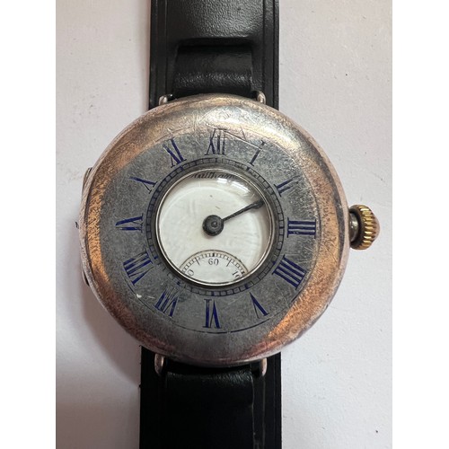 785 - A silver cased half-hunter Waltham wristwatch, with blue enamelled Roman numerals to front case. Dat... 