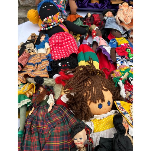 1196 - A quantity of mainly foreign/ tourist dolls to include knitted, wooden and plastic, some hand crafte... 