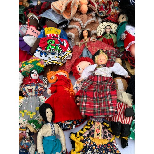 1196 - A quantity of mainly foreign/ tourist dolls to include knitted, wooden and plastic, some hand crafte... 