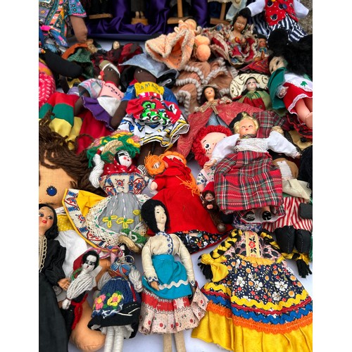 1196 - A quantity of mainly foreign/ tourist dolls to include knitted, wooden and plastic, some hand crafte... 