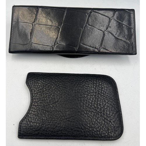 697 - A black leather Mulberry glasses case 17cm x 7cm together with a black leather telephone case 12cm x... 