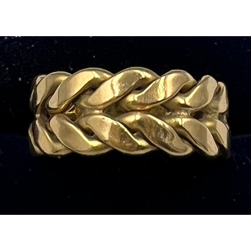 692 - A 18 carat yellow gold ring. Size O. Weight 11gm.