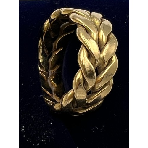 692 - A 18 carat yellow gold ring. Size O. Weight 11gm.