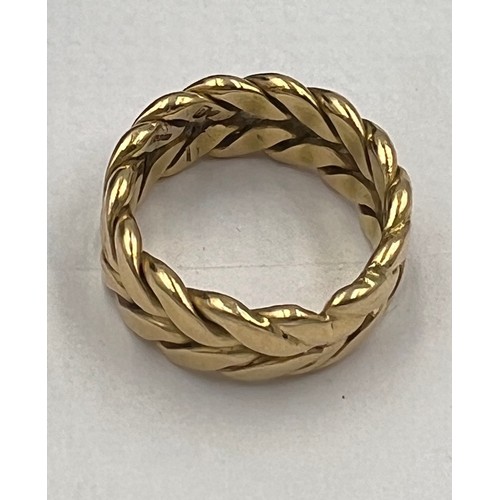 692 - A 18 carat yellow gold ring. Size O. Weight 11gm.