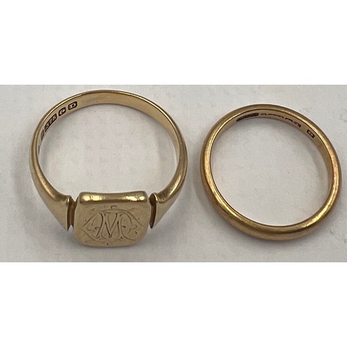 693 - Two 9 carat gold rings, a wedding band, size M and a signet ring, size T. Total weight 7.7gm.