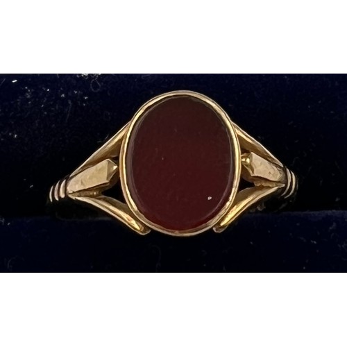 694 - A 9 carat gold ring set with red stone. Size P. Weight 2.3gm.