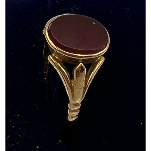 694 - A 9 carat gold ring set with red stone. Size P. Weight 2.3gm.