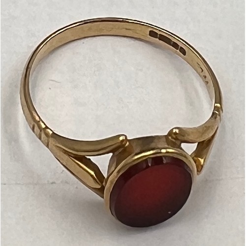 694 - A 9 carat gold ring set with red stone. Size P. Weight 2.3gm.