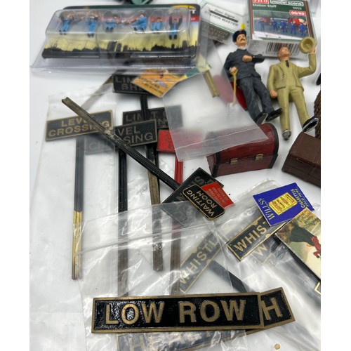 1228 - A collection of various miniature railway accessories to include model train metal railway signs, un... 