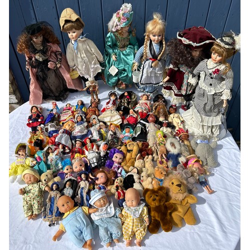 1208 - A collection of various dolls to include vintage tourist dolls, Corolle, Leonardo etc together with ... 