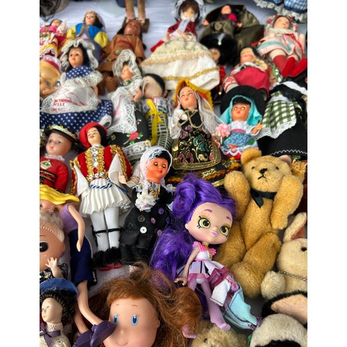 1208 - A collection of various dolls to include vintage tourist dolls, Corolle, Leonardo etc together with ... 