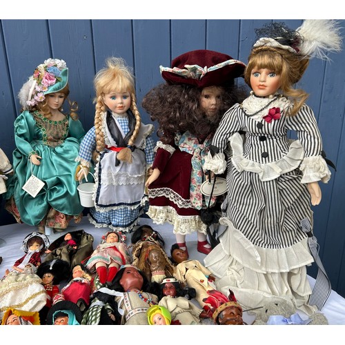 1208 - A collection of various dolls to include vintage tourist dolls, Corolle, Leonardo etc together with ... 