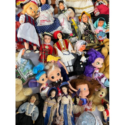 1208 - A collection of various dolls to include vintage tourist dolls, Corolle, Leonardo etc together with ... 