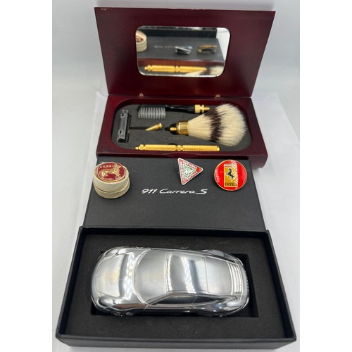 1349 - A miscellaneous lot to include a boxed Porsche 911 Carrera limited edition model 10.5cm l, a wooden ... 