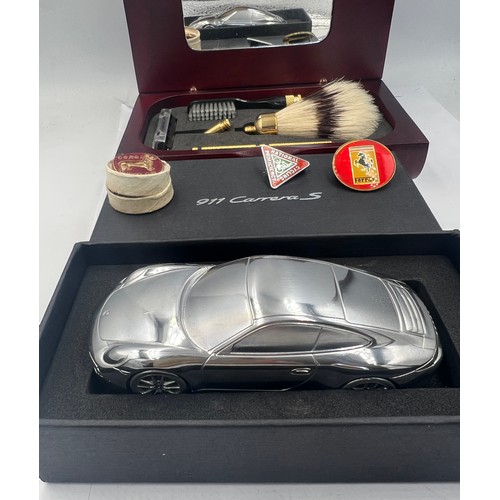 1349 - A miscellaneous lot to include a boxed Porsche 911 Carrera limited edition model 10.5cm l, a wooden ... 